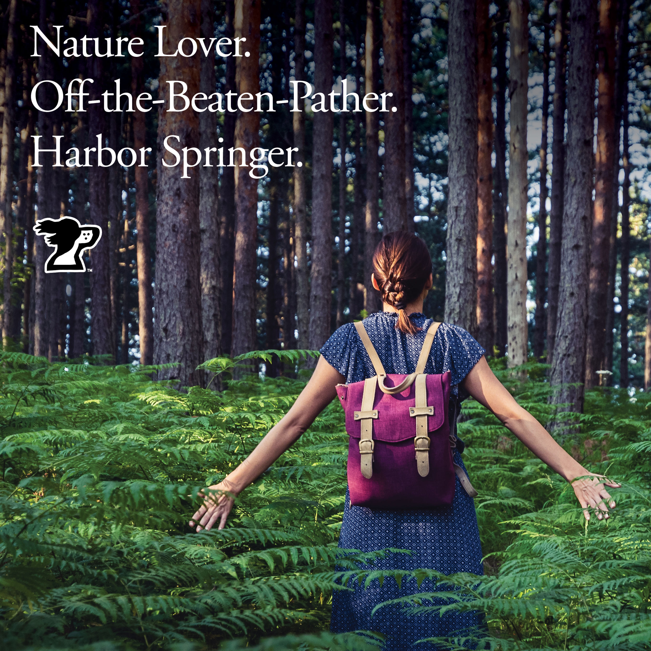 Picture of a woman hiking in the woods from Harbor Springer, a Harbor Springs, Michigan clothing store.
